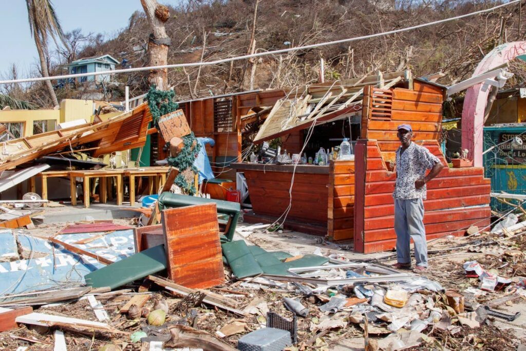  A man stands next to a business destroyed by Hurricane Beryl in Clifton, Union Island, St Vincent and the Grenadines, on July 4. - AP PHOTO