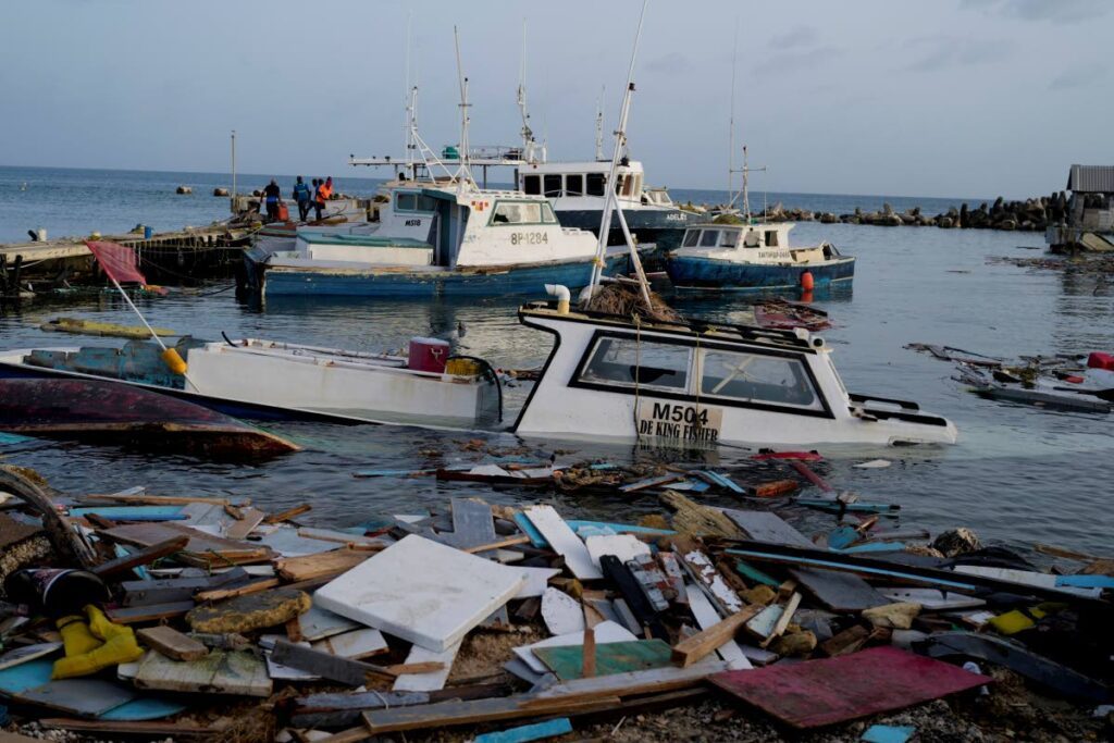 Damaged boats in the water at the Bridgetown Fisheries, Barbados, on July 2 following the passage of Hurricane Beryl on July 1. - AP PHOTO