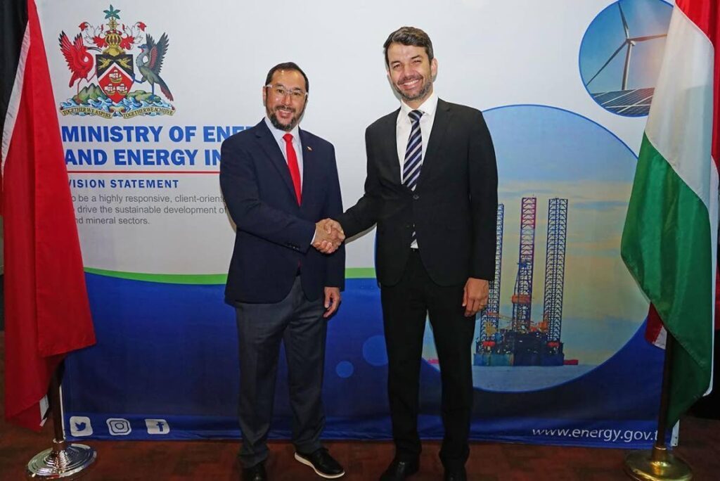 Energy Minister Stuart Young, left, and Hungarian ambassador Balázs Heincz, shake hands after a meeting on energy-related matters at the ministry's office on Friday. 
Photo courtesy MEEI - 