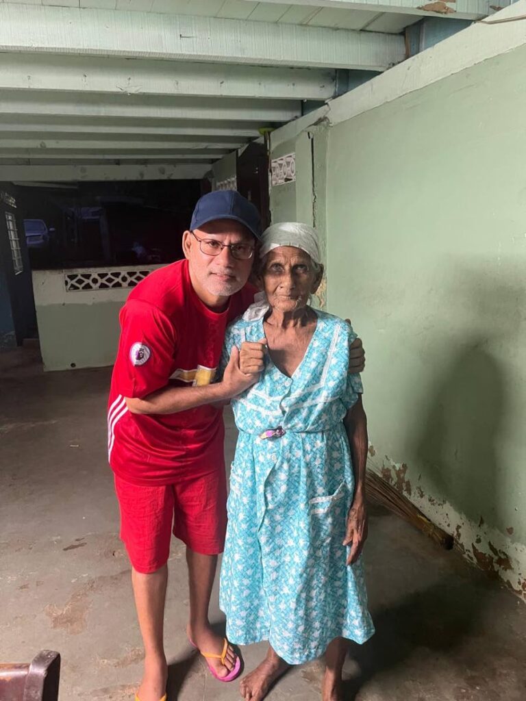 Mukesh Chandradath and his maternal grandmother, Pottiya Mahadeo, age 103, at the familys home in Fyzabad on July 12, after his release from prison after serving more than a decade on death row. - 