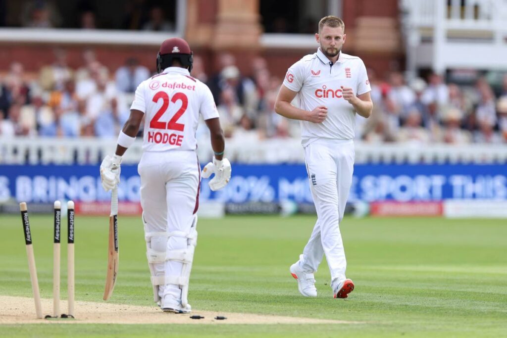 England's Gus Atkinson (R) after taking the wicket of West Indies' Kavem Hodge on day two of the first Test at Lord's Cricket Ground, London, on July 11, 2024. - AP PHOTO