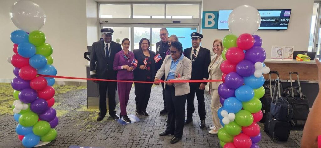 The ribbon-cutting to mark the launch of CAL's service to San Juan Puerto Rico, during a brief ceremony at Piarco International Airport, Trinidad, on July 14.
 - Photo courtesy CAL