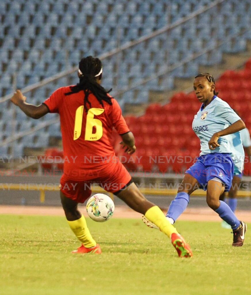 Defence Force attacker Aaliyah Prince (R) plays a pass during the opneing match of the Women Warriors Wellness invitational tournament against Grenada at the Hasely Crawford Stadium in Mucurapo on July 13. Photo courtesy TT Sport Diary.  - 