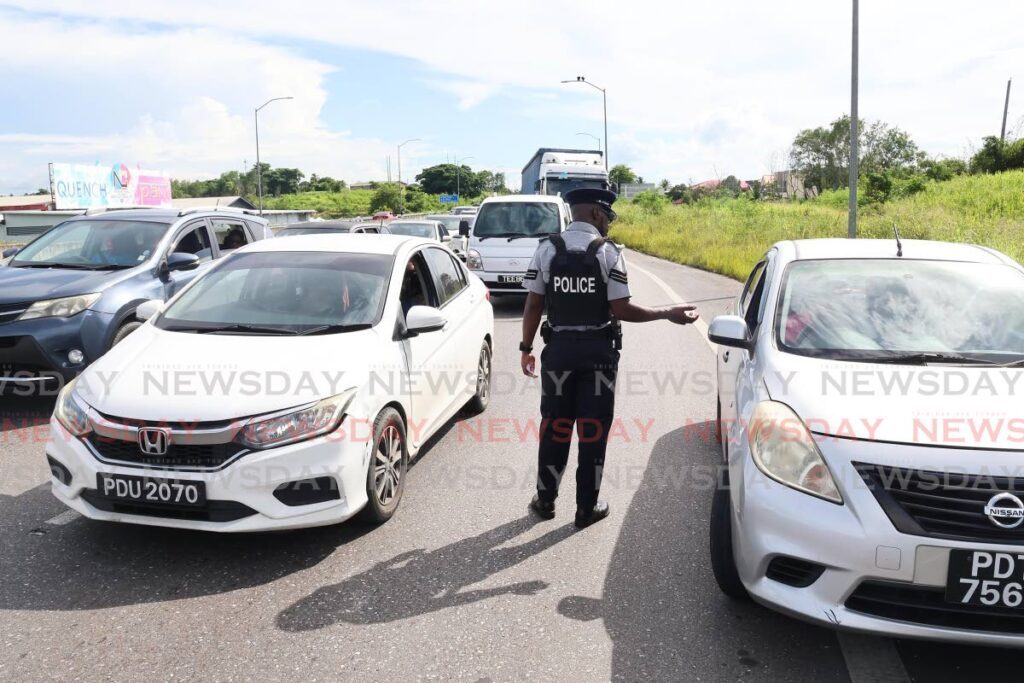 Police officers from the Southern Division in road exercises along the South Trunk road, La Romaine on Thursday. - Lincoln Holder