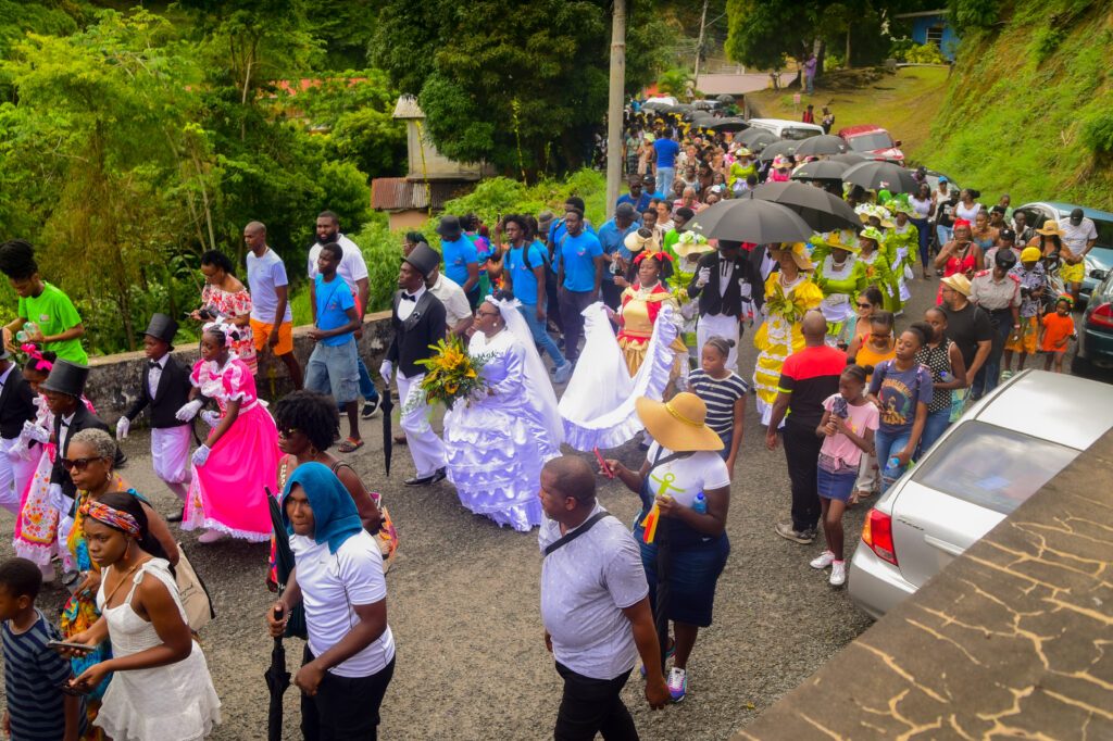 The procession of the bride and groom makes its way along the streets of Moriah on July 20. Recreating the ole-time wedding is a highlight of the Tobago Heritage Festival calendar. - Photo by Visual Styles