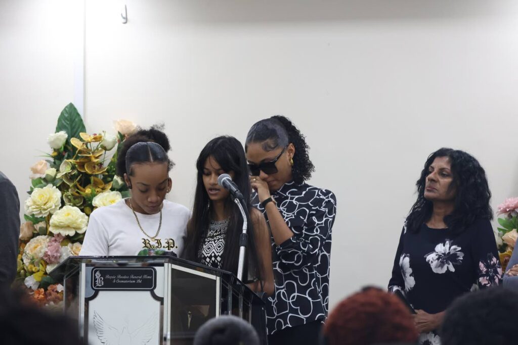 In this file photo, close friends of Quinton Gabriel, Alyssa Jones, left, and Viashali Rampersad, as well as students of Siparia West Secondary School, shared a poem at Gabriel's funeral which was held at Boysie Boodoo Funeral Home and Crematorium in Penal on July 20. Radheka Kissoonlal, principal of Siparia West Secondary School also attended the funeral service. - Photo by Venessa Mohammed