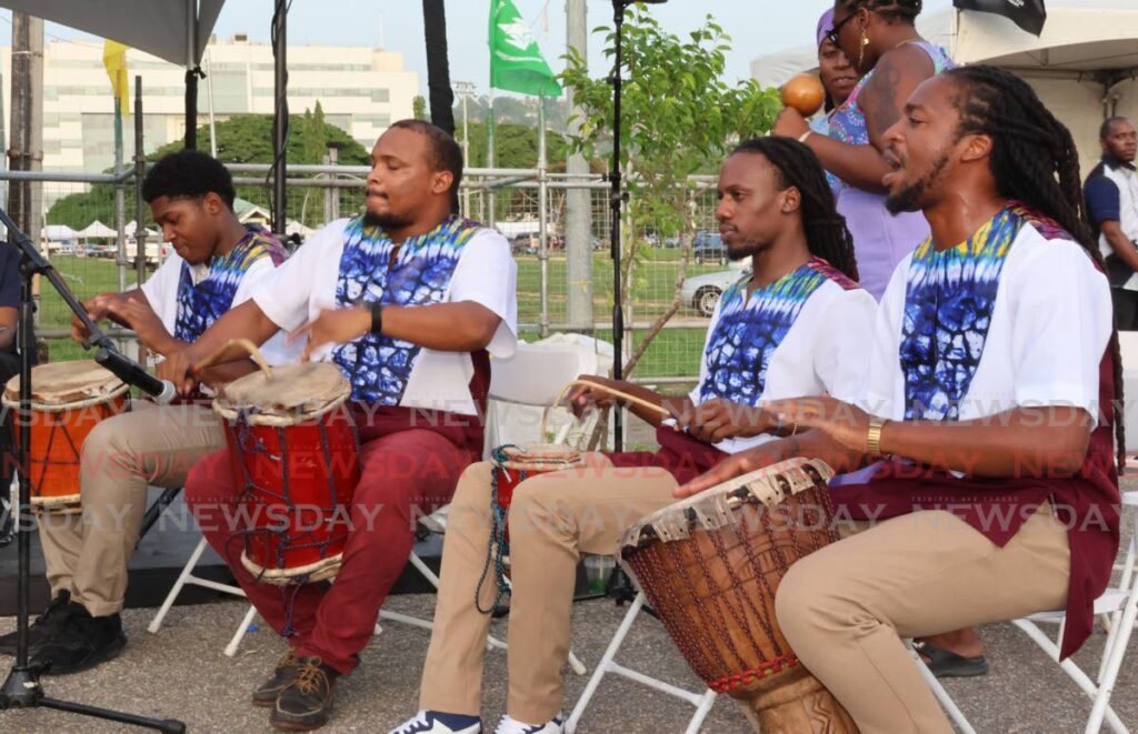 Drummers from Egbe Omo Oni Isese perform during the Blessing of the Grounds ceremony hosted by the Emmancipation Support Committee at the Queens Park Savannah, Port of Spain on July 21. - ROGER JACOB