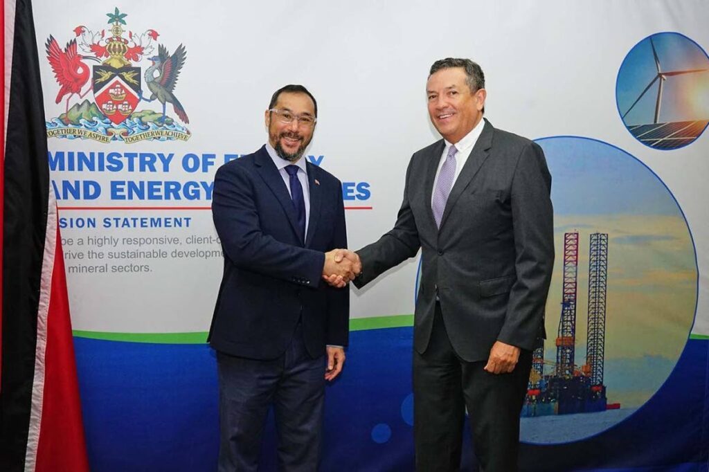 Stuart Young, Energy Minister, left, shakes hands with Bernardo Requena, CAF representative in TT, during a meeting at the ministry's head office in Port of Spain.
- Photo courtesy MEEI  