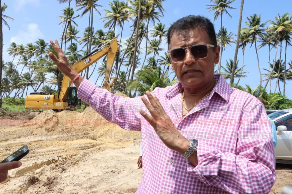 Minister of Works Rohan Sinanan describes the process used to rebuild the Manzanilla Road at a media tour of its construction progress on July 24. - Photo by Angelo Marcelle