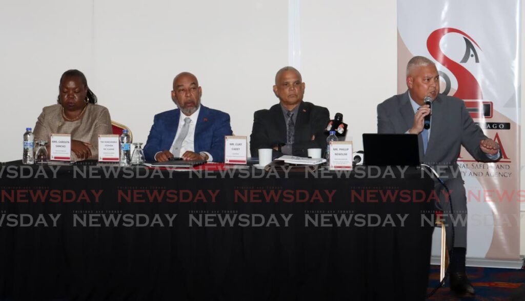 From left, Carolyn Sancho, Executive Director at Occupational Safety and Health Agency (OSHA), Stephen Mc Clashie, Minister of Labour, Curt Cadet, Chairman of OSHA and Phillip Newsum, Executive Director of ADCI on the panel of speakers for the OSHA consultation on commercial diving regulations at Radisson Hotel, Wrightson Road, port of Spain on July 25. - Photo by Faith Ayoung