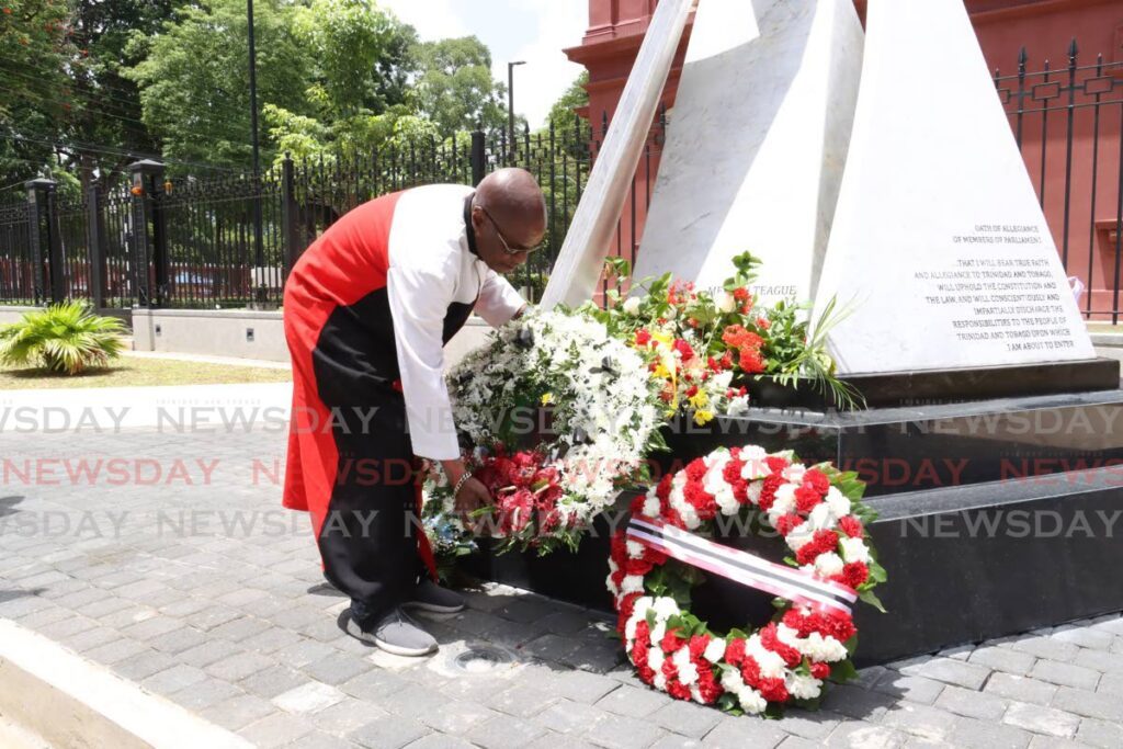 Former 1990 attempted coup hostage Wendell Eversley pays tribute to those who died on the 34th anniversary of the insurrection outside the Red House on July 27.  - Photo by Faith Ayoung