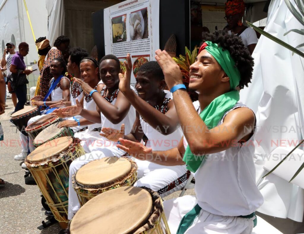 Drummers of the San Juan South Cultural Organisation perform during the opening of the Lidj Yasu Omowale Village at the Queen's Park Savannah, Port of Spain on July 27. - AYANNA KINSALE