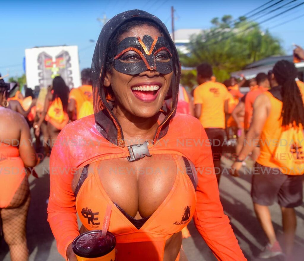 A masked masquerader during the Plymouth J'Ouvert celebrations in Tobago on July 27. - Photo by Visual Styles