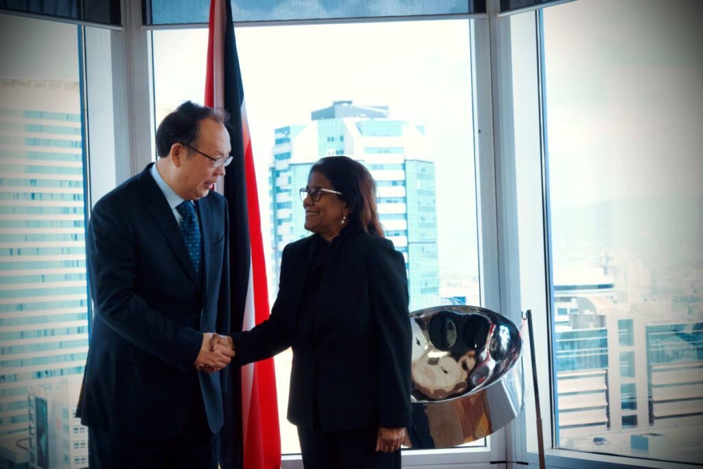 Minister of Trade and Industry Paula Gopee-Scoon welcomes vice chairman of the Anhui Provincial Committee of the Chinese Political Consultative Conference Zhou Xi’an to the ministry during a courtesy call in Port of Spain on July 26. - Photo courtesy MTI