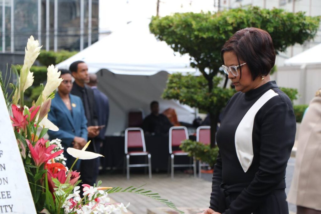 President Christine Kangaloo pays her respects at the Cenotaph, a monument to those who lost their lives during the 1990 attempted coup, at the Red House, Abercromby Street, Port of Spain, on July 29. - Photo courtesy Parliament