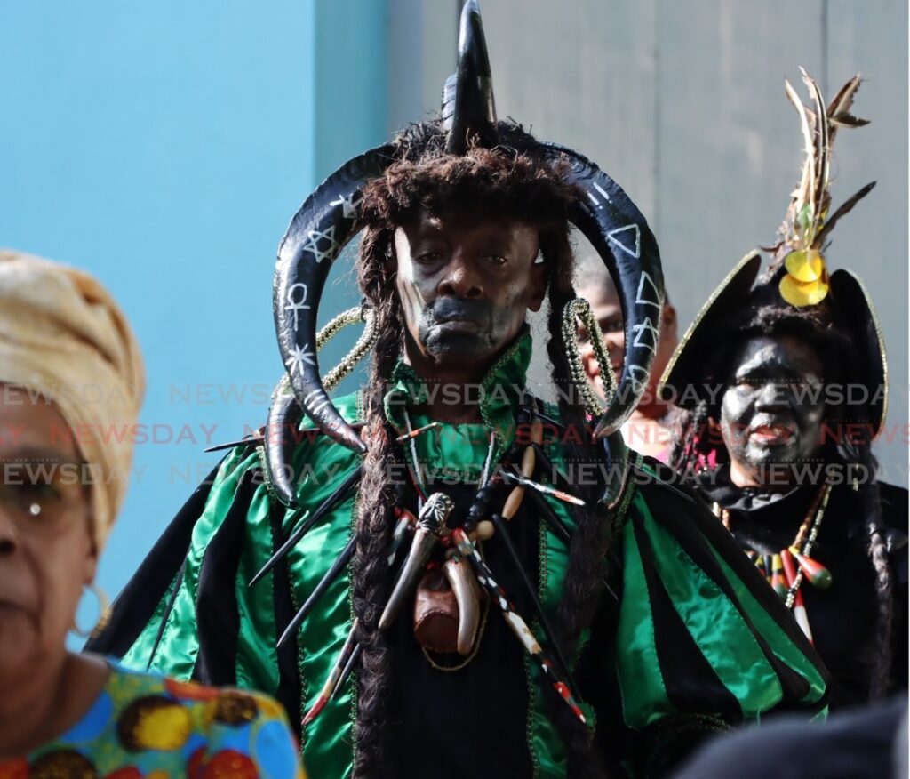 A Black Indian performs the libation ritual offering at the La Venezuela Gardens during the Heritage Masquerade Festival, Santa Cruz Old Road on July 27. - Photo by Ayanna Kinsale