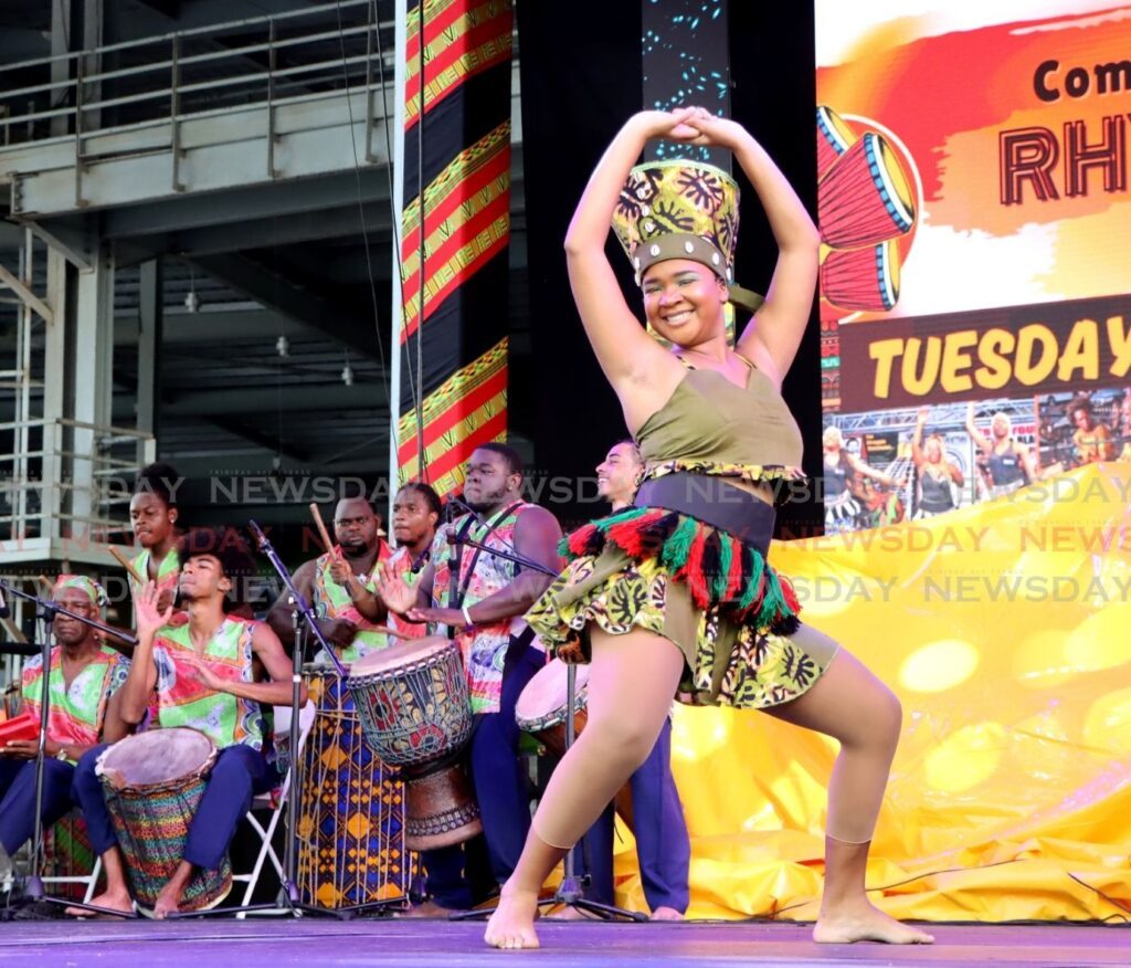 TT'S AFRICAN CULTURE: A dancer from the Chaguanas Women and Youth Group gives an energetic dance performance at the Lidj Yasu Omowale Emancipation Village, Queen's Park Savannah, Port of Spain on July 30. The country celebrates African Emancipation Day with a public holiday on August 1. - Photo by Ayanna Kinsale