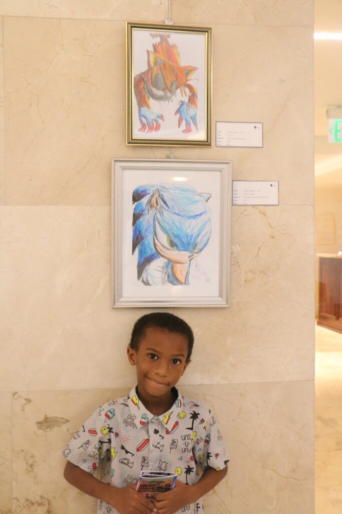 Six-year-old Neymar Nicholas is the youngest artist to his work showcased at the Rotunda Gallery's Comic, Cartoon, Digital art and Animae exhibit. - Photo courtesy the Rotunda Gallery