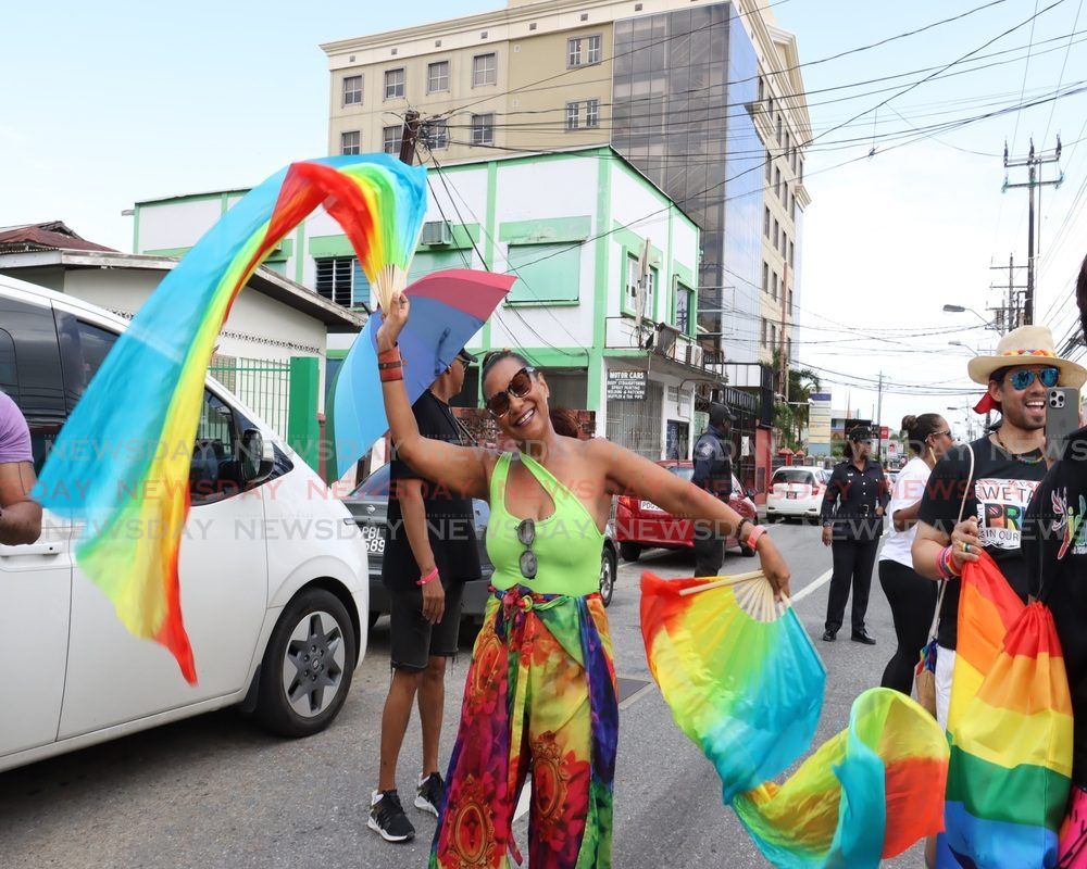 This woman enjoys herself during the Pride parade on Maraval Road, Port of Spain, on July 28. - Photo by Faith Ayoung