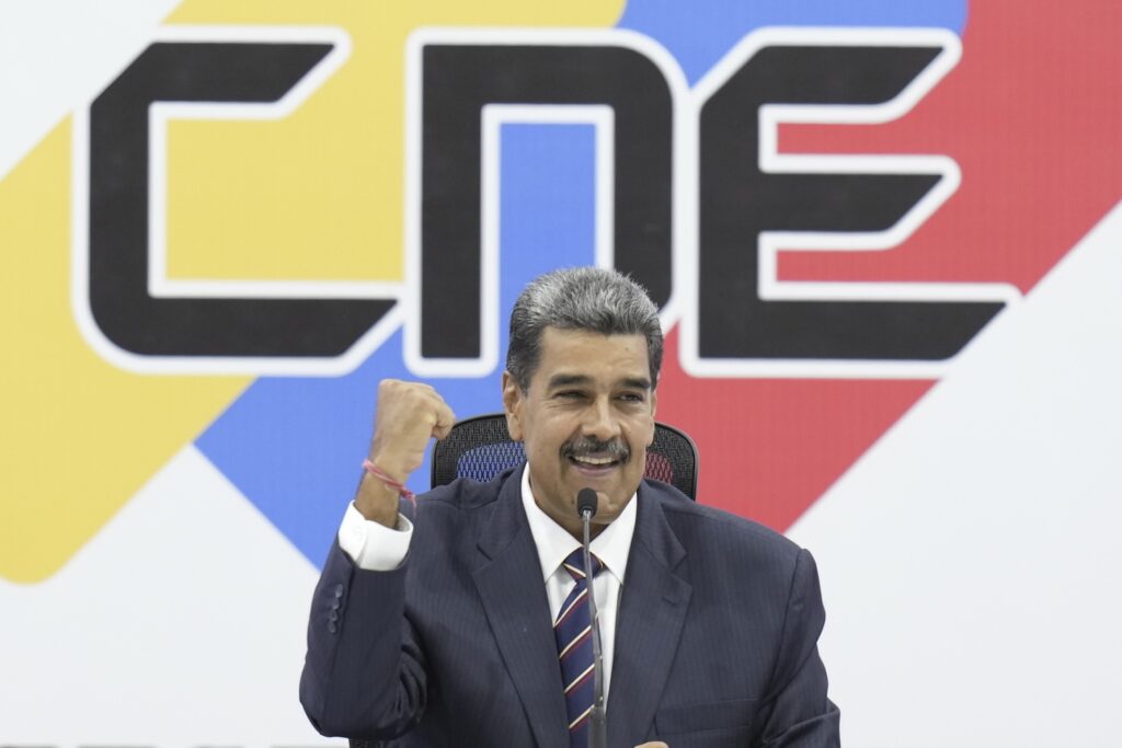 OH YES! Venezuelan President Nicolas Maduro attends a ceremony at the National Electoral Council (CNE) that certifieD him as the winner of the presidential election in Caracas, Venezuela on Monday. AP PHOTOS - 