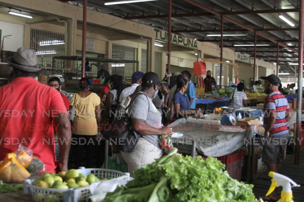 Shoppers and vendors at the Tunapuna Market in June, 2021. - File Photo 