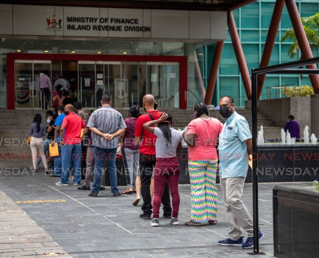 Long lines outside the Ministry of Finance, Inland Revenue Division, Port of Spain. - File photo by Jeff K Mayers 