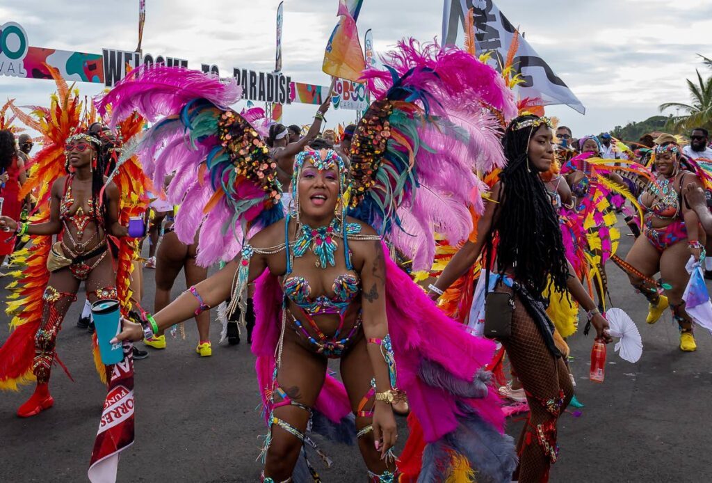 In this file photo, masqueraders of Arcadia Mas Band jump on the new Rockly Bay stage during the Tobago carnival parade of the bands along Milford Road, Scarborough, in October 2022. - File photo