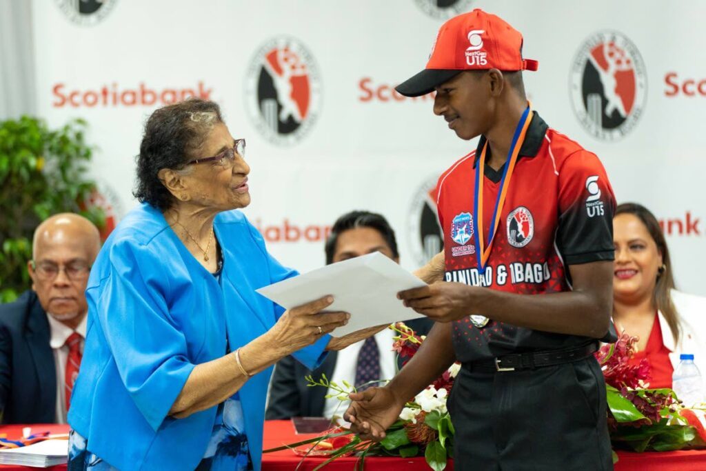 Scotiabank Foundation patron and former First Lady Zalayhar Hassanali presents Brendan Boodoo, captain of the TT Under-15 team, with his medal and certificate following the team's win of the CWI Rising Stars Under-15 tournament in 2023. - File photo courtesy Scotiabank