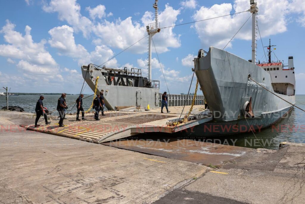 Customs officers board the Emprendedora cargo vessel at the Cruise Ship Complex, Port of Spain last year. - Jeff K Mayers/File photo