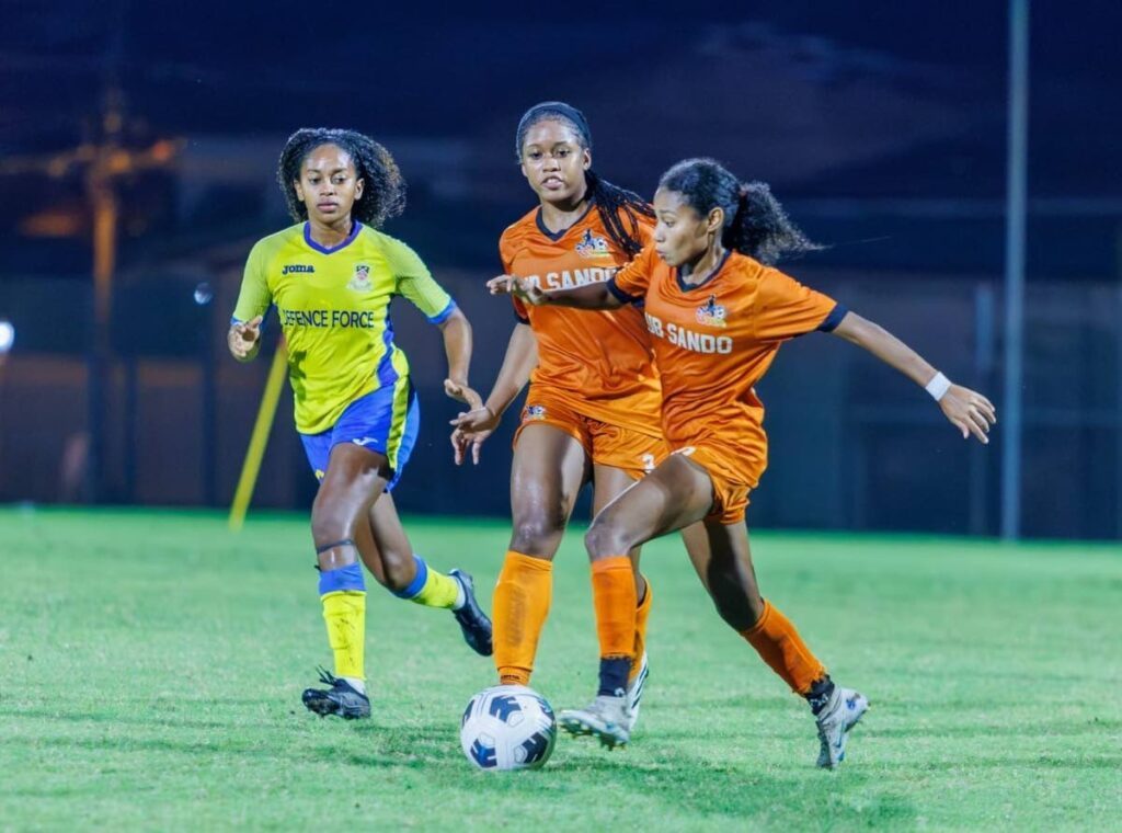 Club Sando's Alexcia Ali, right, on the attack against Defence Force in the 2023 WoLF semis in Diego Martin. - WoLF