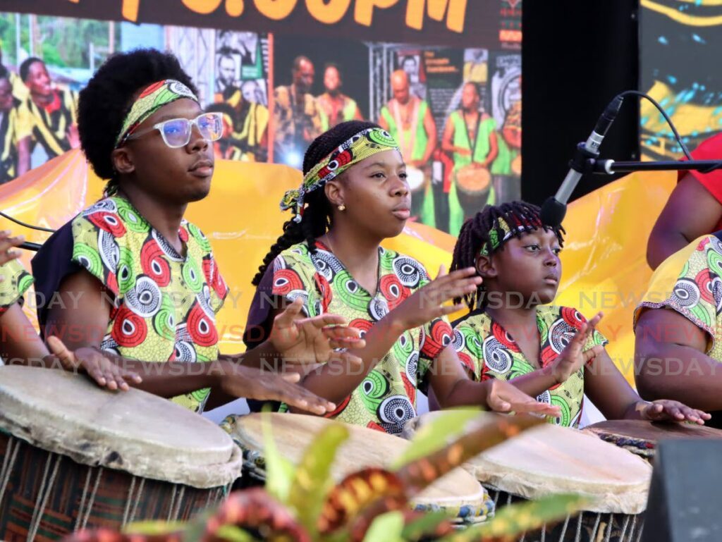 Drummers of the Malick Folk Performing Company perform during Rhythms and Voices Africa at the Lidj Yasu Omowale Village at the Queen’s Park Savannah, Port of Spain on July 30. - Photo by Ayanna Kinsale 