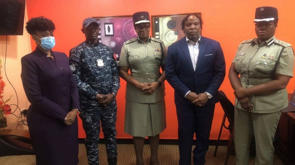 LET'S POSE: From left, DCP Suzette Martin, DCP Junior Benjamin, Commissioner of Police Erla Harewood-Christopher, Minister in the Ministry of National Security Keith Scotland and DCP Natasha George after a meeting on July 31 at the ministry's head office in Port of Spain. -Photo courtesy Ministry of National Security 