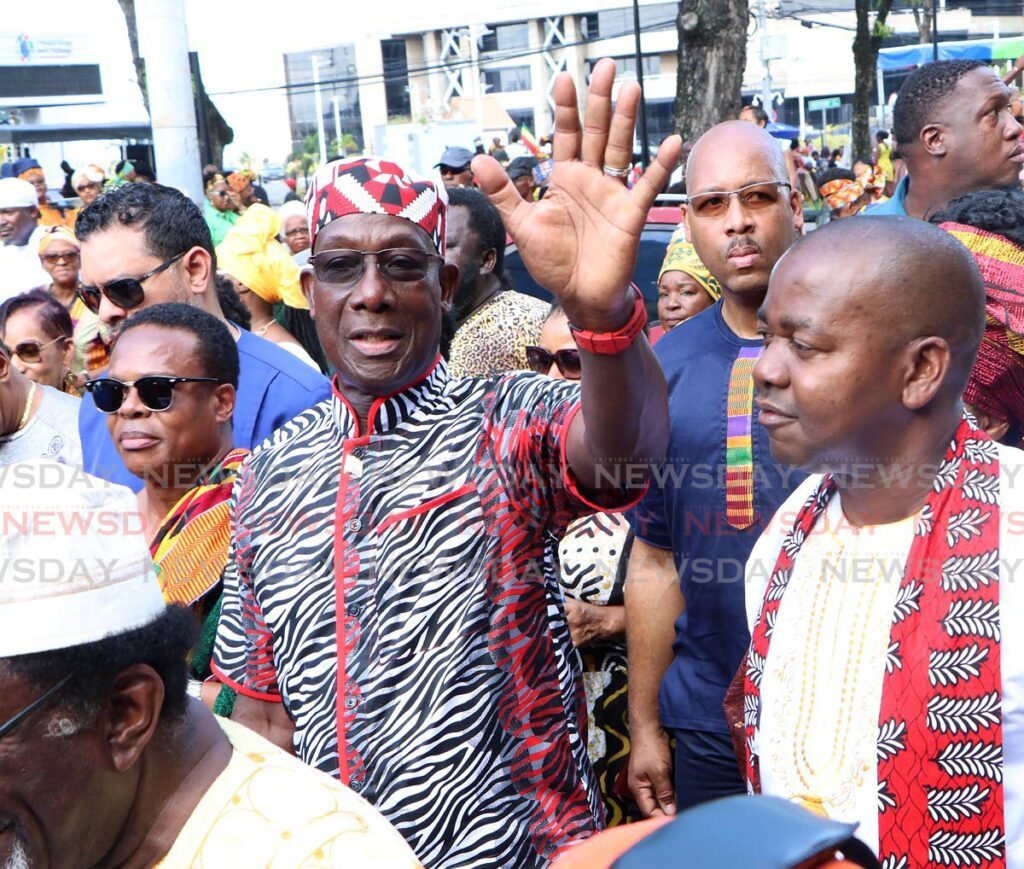 The Prime Minister walks with members of Cabinet as he takes part in the Kambule Street Procession during African Emancipation Day celebrations on Independence Square, Port of Spain, on August 1. - Photo by Angelo Marcelle