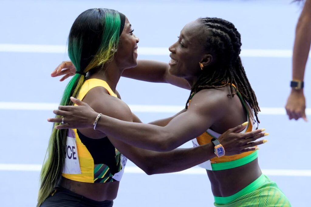 Shelly-Ann Fraser-Pryce, of Jamaica, left, hugs Marie-Josee Ta Lou-Smith of Ivory Coast after a heat in the women's 100-metre event at the 2024 Olympics on August 2 in Saint-Denis, France. AP PHOTO - 