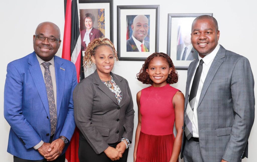 Minister of Youth Development and National Development Foster Cummings, right, NEDCO’s CEO Calvin Maurice, left, and Chief Entrepreneurial Executive Officer Karen Caraballo share a photo with Dominique Thorne, actress in Black Panther: Wakanda Forever. - 