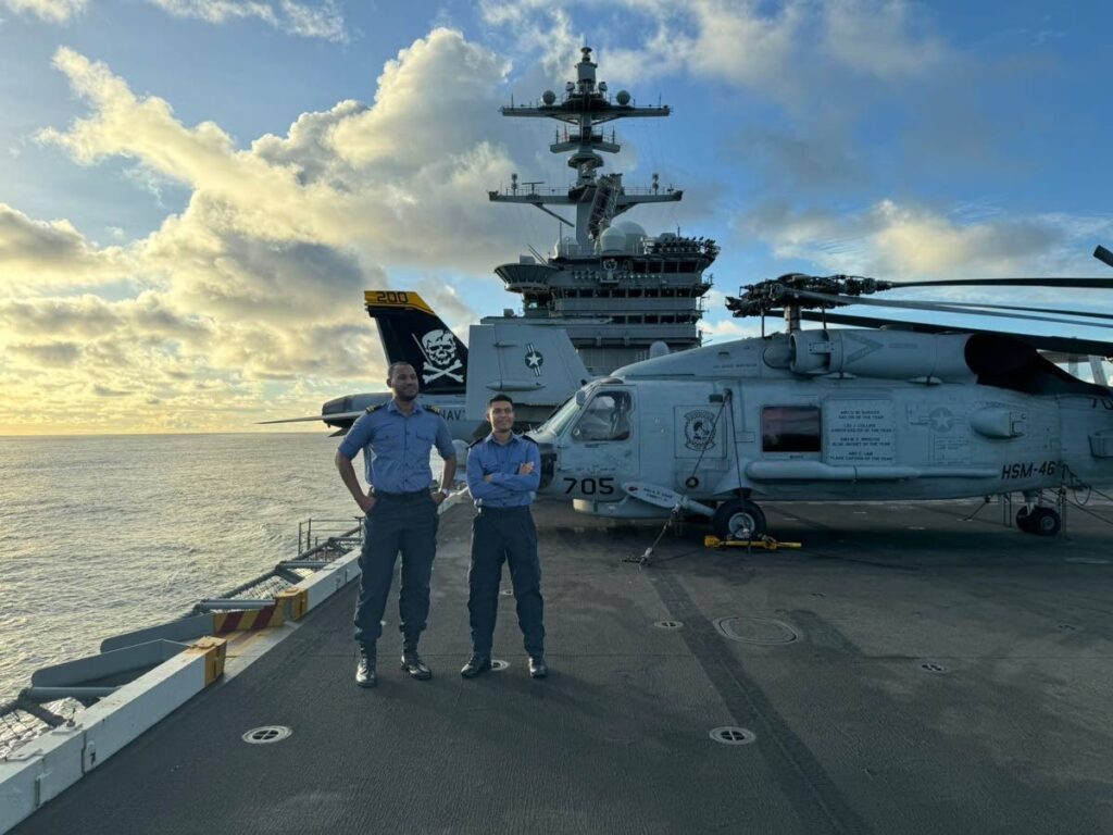 Trinidad and Tobago Coast Guard officers Lt Jadon Robinson, left, and Lt Cdr Amit Ramlal onboard the USS Washington. - 