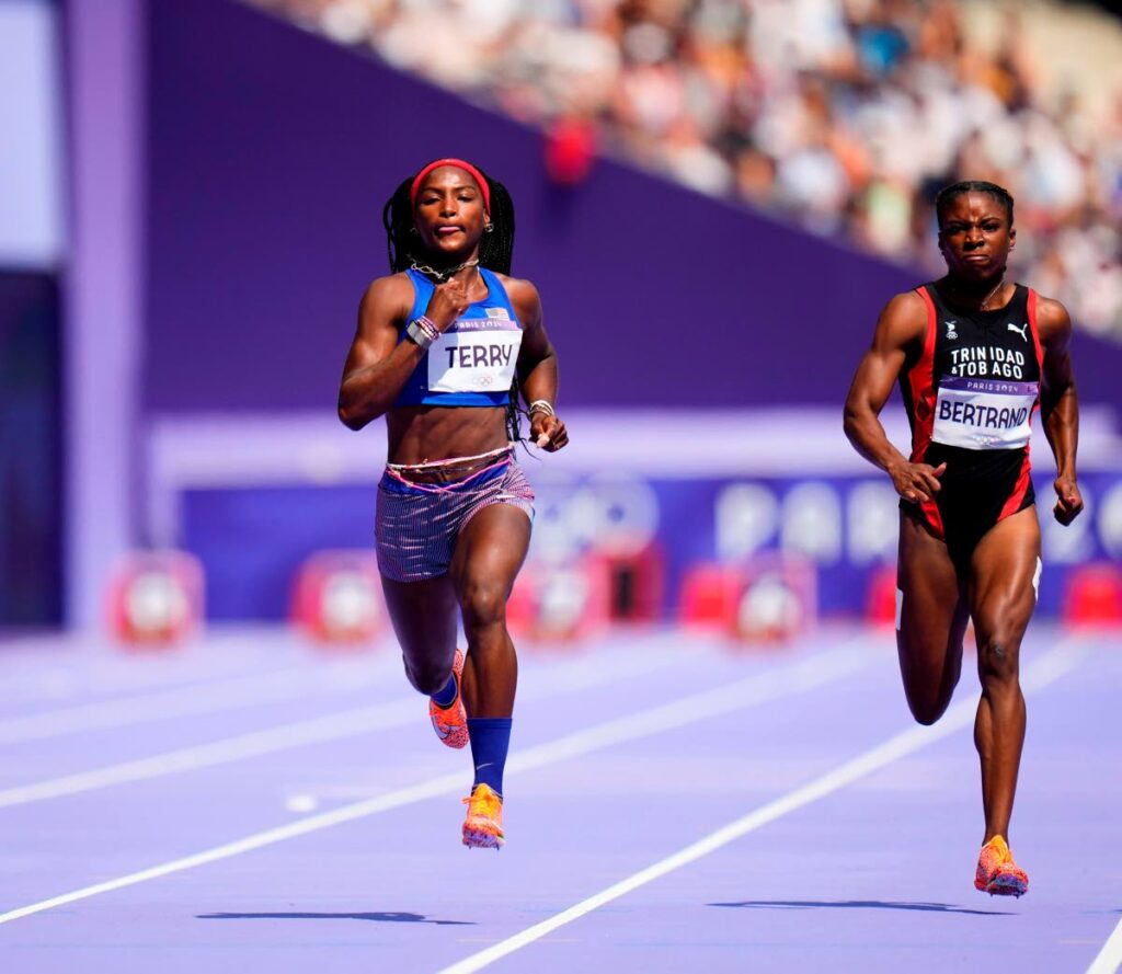 TT women's sprinter Leah Bertrand, right, and Twanisha Terry of the US, compete in a 100m heat at the 2024 Olympics on August 2 in Saint-Denis, France. Bertrand finished third to qualify for the semifinals. AP PHOTO. - 