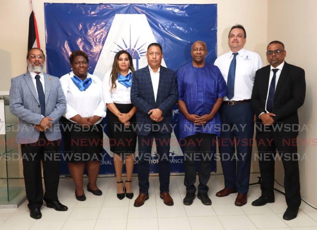 National Transformation Alliance political leader Gary Griffith, centre, stands with newly-installed constituency custodians, Insaf Enightoola (Barartaria)/San Juan), Gail Castanada (Port of Spain South), Nicolene Chinchamee (Lopinit/Bon Air West), Errol Fabien (Point Fortin), Russel Chan (Diego Martin Central) and Norman Dinidial (Chaguanas East) at the party's headquarters in Mt Lambert, on August 3. - Photo by Faith Ayoung