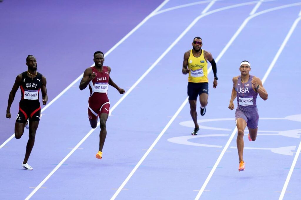 Jereem Richards, of Trinidad And Tobago, from left; Ammar Ismail Yahia Ibrahim, of Qatar; Anthony Jose Zambrano, of Colombia; and Michael Norman, of the US, compete in a men's 400 metres round one heat at the 2024 Olympics. - AP PHOTO