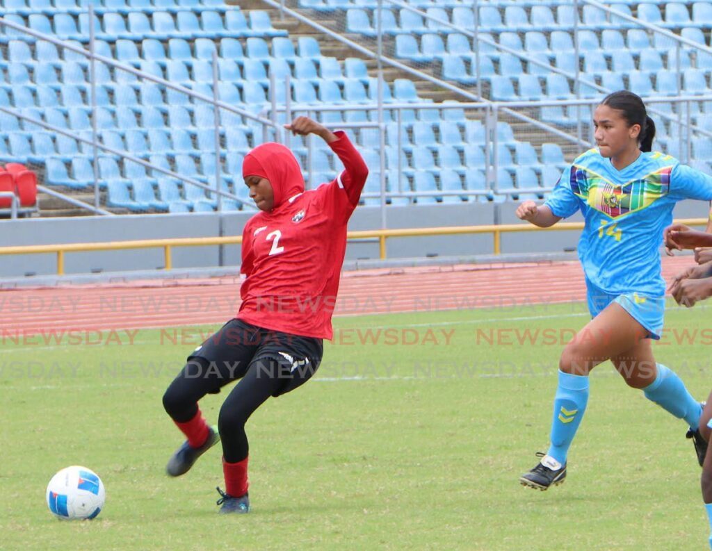 TT High Performance defender Ahmeeda Bowman gets the ball to safety from USVI midfielder Ashleigh Speakman, during the Girls Under-15 Concacaf Championships at the Hasely Crawford Stadium, Mucurapo on August 5.  - Photo by Angelo Marcelle