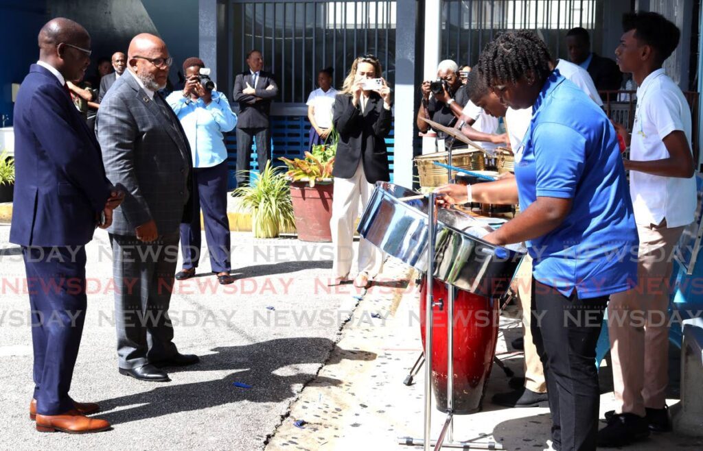 UN General Assembly president Dennis Francis, second left, admires the performance of the Woodbrook Secondary School Drummology and Rhythm Section Club at Woodbrook Secondary School, French Street, Woodbrook, on August 6. - Photo by Gabriel Williams