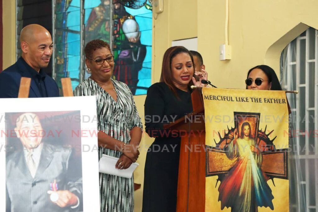 Astra Babb-Lutchman, granddaughter of former Newsday editor John Babb, centre, is emotional as she delivers a eulogy as family members look on at his funeral at St John The Evangelical RC Church in Diego Martin on Thursday. - Photo by Venessa Mohammed