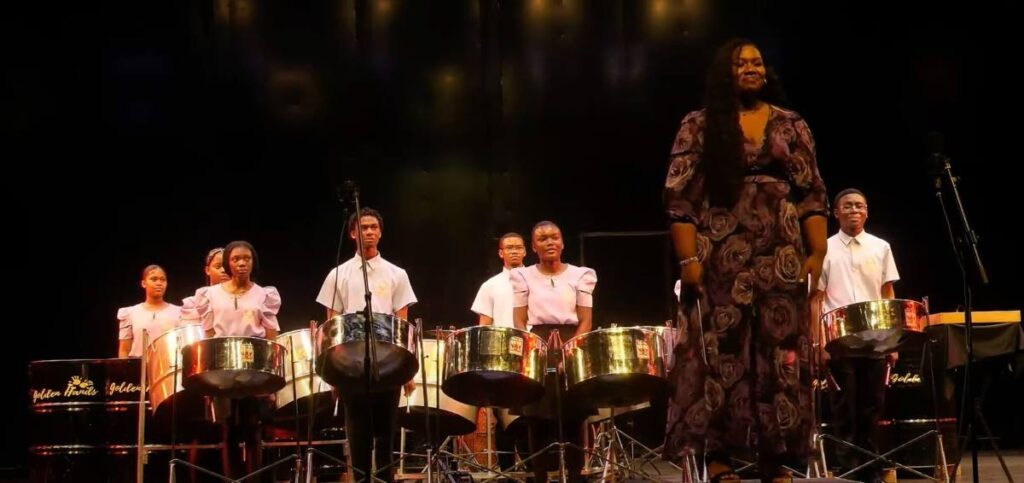 Golden Hands on stage with Vanessa Headley-Brewster during the ensemble category of the National Steelband Music Festival. Photo courtesy WACK RADIO - 