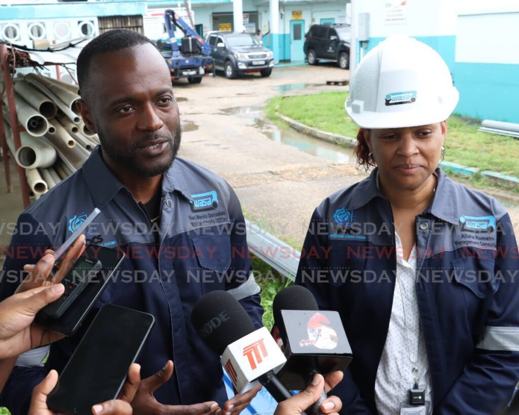 Minister of Public Utilities Marvin Gonzales and Alisha Romano, acting director of corporate services, speak to reporters at WASA's El Socorro Water Works Chlorine Disinfection Facility on Churchill-Roosevelt Highway, El Socorro, on August 10. - Faith Ayoung