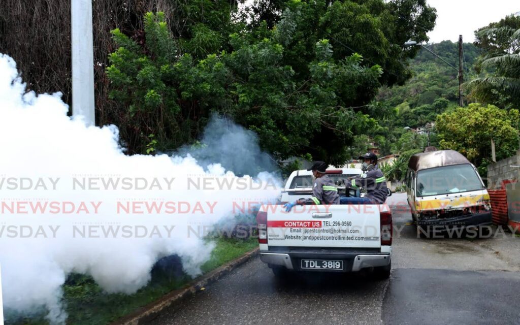 J&P Pest Control Ltd conducts free spraying for mosquitoes for the community of Covigne Road, Diego Martin to help prevent the spread of dengue, on August 10. - File photo by Faith Ayoung