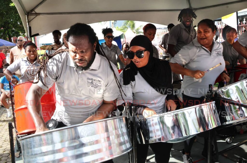 Tenor players from the Chord Masters Steel Orchestra were filled with excitement as they participated in the celebrations on August 11. - Photo by Roger Jacob