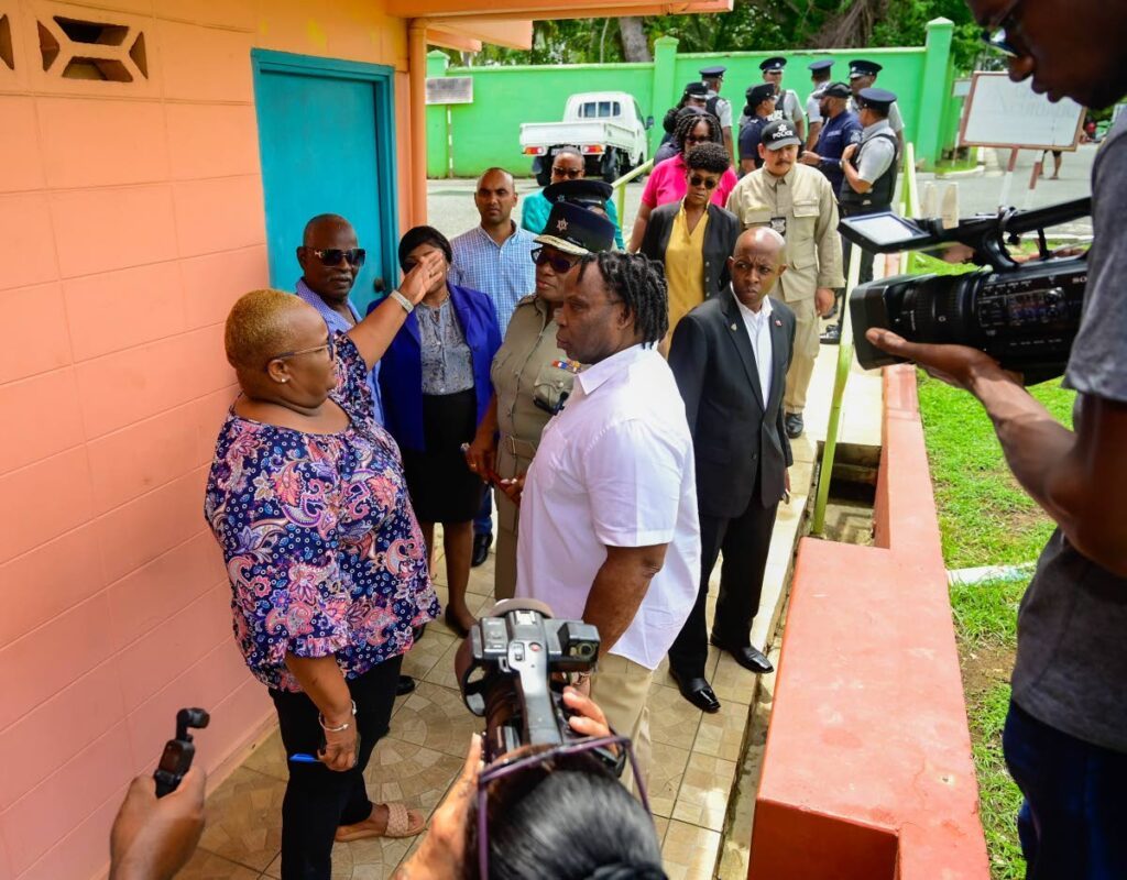 Store Bay Beach Facility manager Sadiemo Harry, left, talks to Keith Scotland, minister in the ministry of national security, and CoP Erla Harewood-Christopher during a walkabout in Crown Point, Tobago on August 12. - Photo courtesy Visual Styles