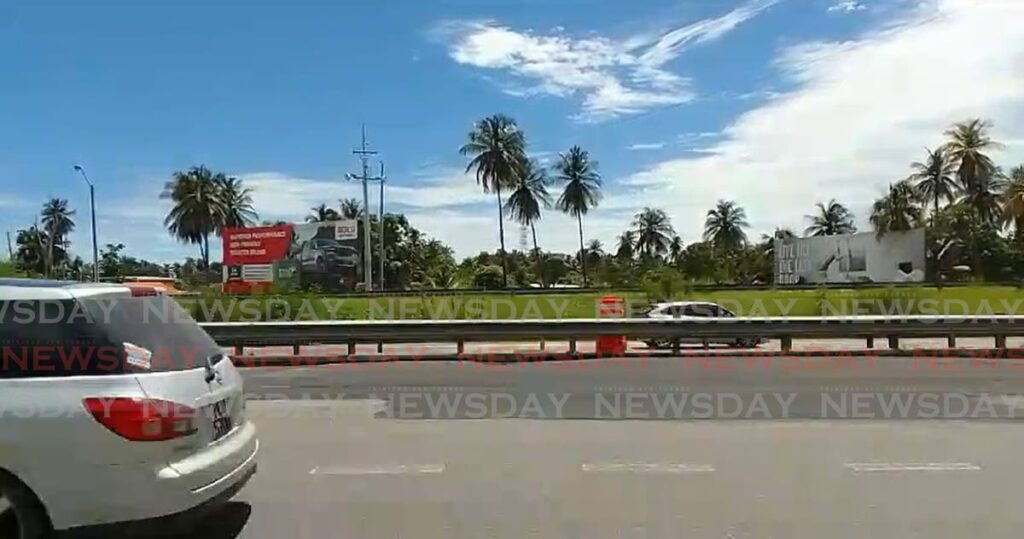 Minister of Works and Transport Rohan Sinanan says the depression along the Uriah Butler Highway near Grand Bazaar has been temporarily repaired.
 - Photo by Roger Jacob