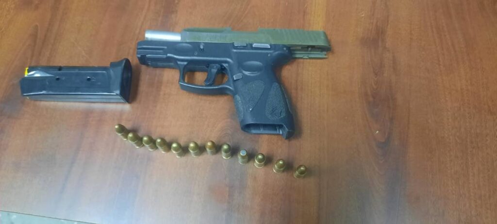 The gun and ammo that police found on a man on August 17. - 