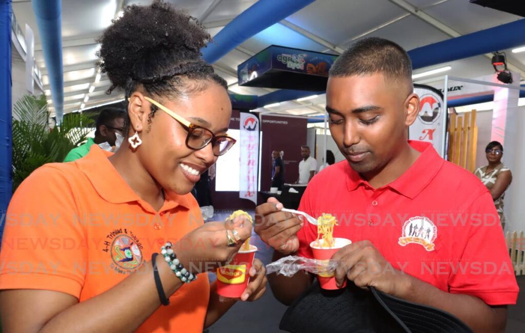 Attendees enjoy samples from the exhibitors at the TT Agri Expo 2024 on August 16. - Photo by Faith Ayoung